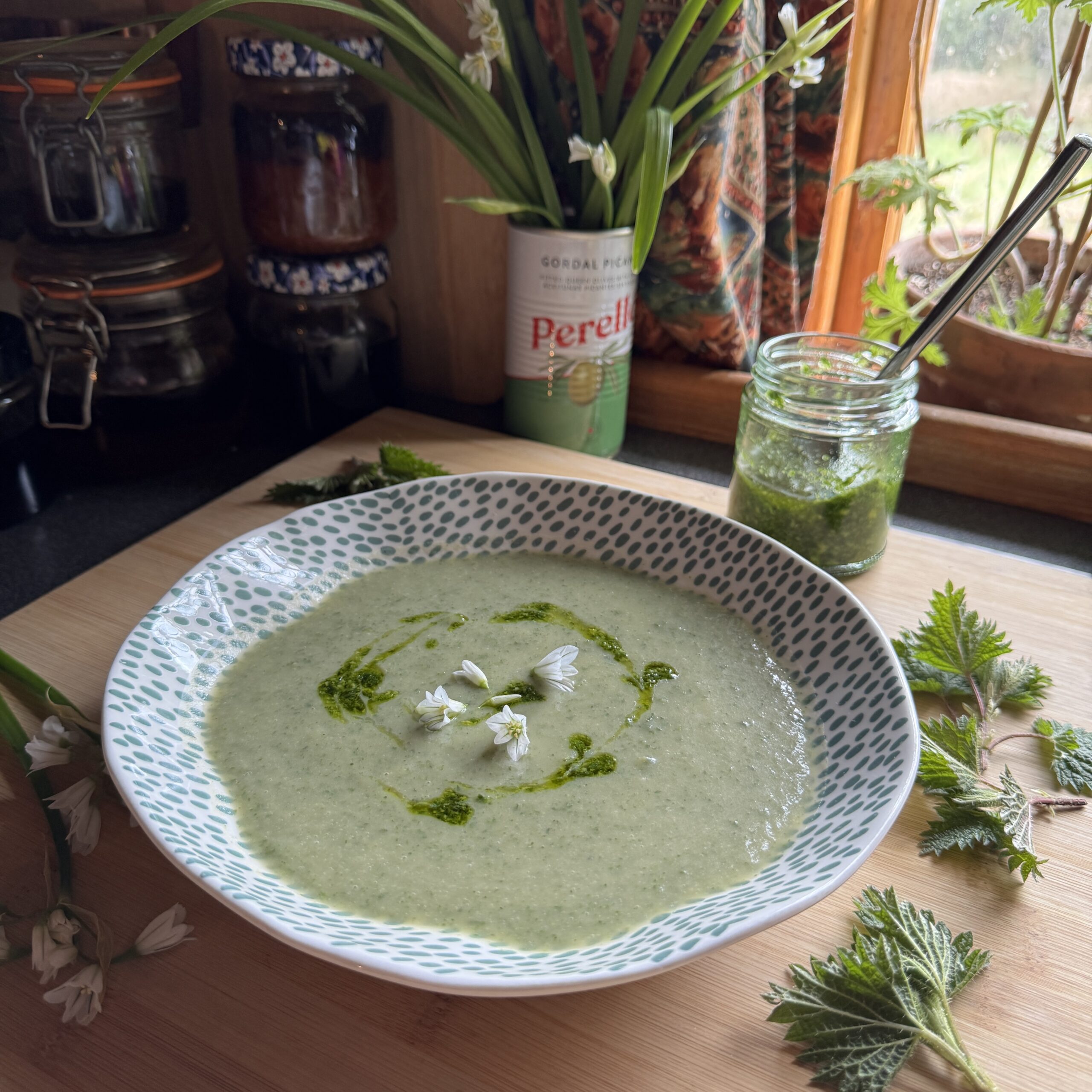 Bowl of nettle soup with wild garlic pesto