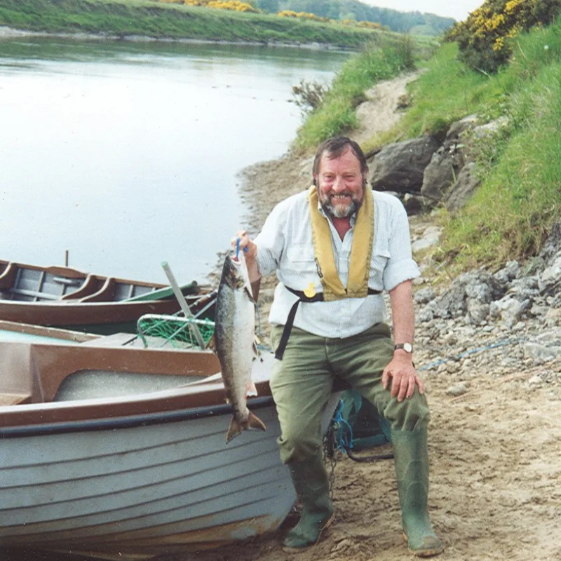 Dad with salmon and boat